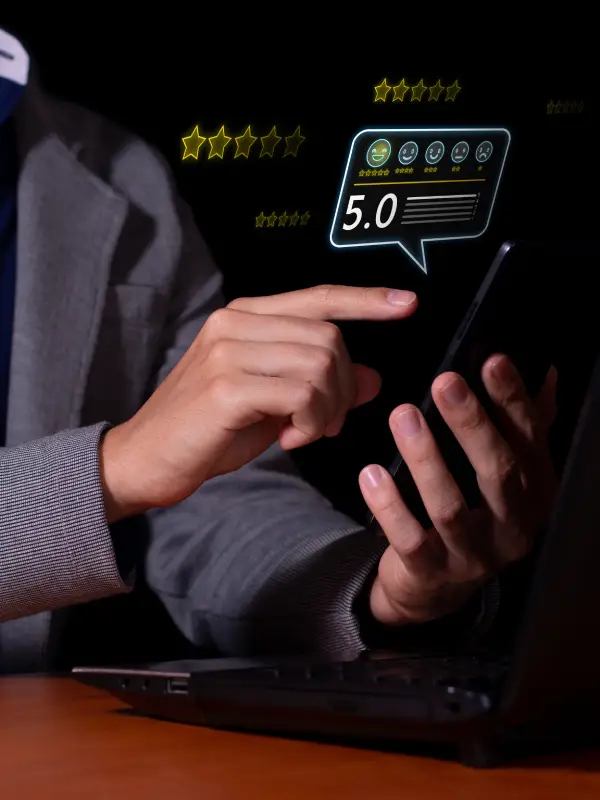 A person using a smartphone to give a 5-star rating on a digital feedback interface
