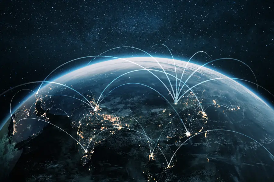 Digital illustration of the Earth from space with glowing network connections linking different regions